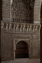 Nasrid Palace, wall niche with rich stucco framing and calligraphic elements