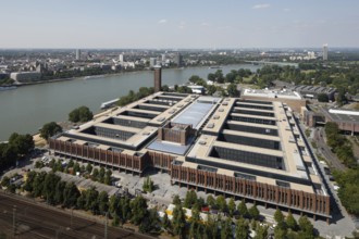 Former exhibition centre, Rheinhallen and Messeturm on the banks of the Rhine north of the