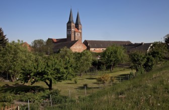 Distant view from the Elbe dyke in north-west direction, surrounded by farm buildings, St., Sankt,