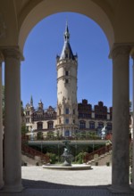 In front orangery around 1850 by F. A. Stüler, above it main tower, on the right large NEW HOUSE,