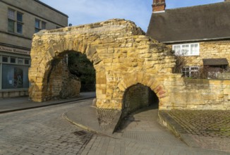 Newport Arch on Ermine Street, Roman entrance gateway to city of Lincoln, Lincolnshire, England, UK