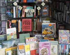 Shop window display of secondhand books in Dorothy House charity shop, Chippenham, Wiltshire,