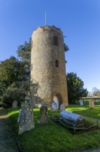 Detached round tower of village parish church of Saint Andrew, Bramfield, Suffolk, England, UK