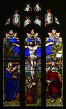 Stained glass window of Jesus Christ Crucifixion Cross, church of Saint John the Baptist, Devizes,