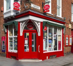 Post Office corner shop painted bright red, Eastgate, Bailgate, Uphill area of city of Lincoln,