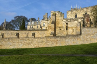 Walls of medieval Bishops' Palace from Temple Gardens park, city of Lincoln, Lincolnshire, England,