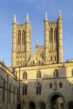 Towers of cathedral church rise above the medieval Exchequer Gate, Lincoln, Lincolnshire, England,