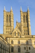 Towers of cathedral church rise above the medieval Exchequer Gate, Lincoln, Lincolnshire, England,