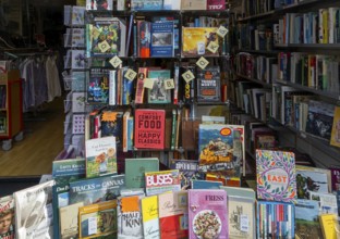 Shop window display of secondhand books in Dorothy House charity shop, Chippenham, Wiltshire,