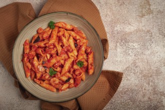 Penne pasta, with shrimp in tomato sauce, close-up, no people