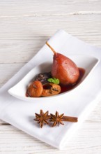 Pear helene in red wine with spices