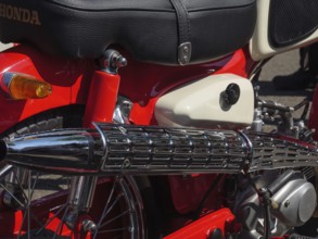 Red retro motorbike with chrome-coloured exhaust and black seat, Appelhülsen, münsterland, germany