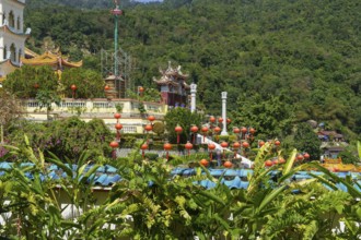 Hilly landscape with temples and hanging lanterns. Surrounded by green nature, penang, malaysia