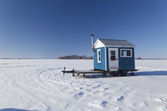 Winter, ice fishing hut on the Saint Lawrence River, Province of Quebec, Canada, North America