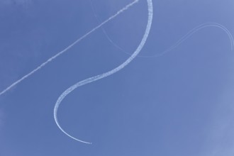 Airshow, plane with contrails against blue sky, Montreal, Province of Quebec, Canada, North America