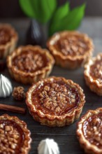 Several warm, flaky pastry tarts sit atop a dark wood surface, each filled with a sweet,