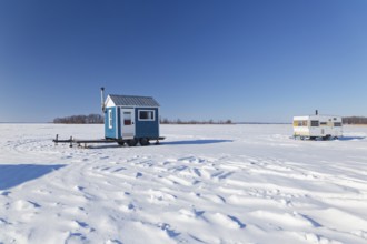 Winter, ice fishing hut on the Saint Lawrence River, Province of Quebec, Canada, North America