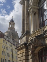 Baroque church tower with surrounding historic buildings under a blue sky, dresden, saxony, germany