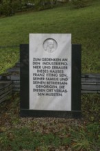 Probstzella, HAUS DES VOLKES, modern memorial stone in the park with marble relief of the founder