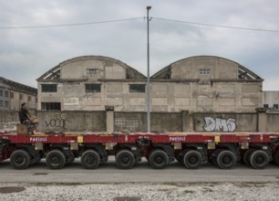 Porto Marghera near Venice, industrial harbour, warehouse with low loader