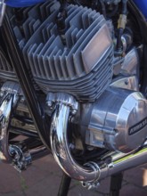 Close-up of a Kawasaki motorbike engine with blue and chrome-plated components, Appelhülsen,