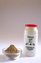 Ayurvedic medicine triphala churna powder for relief from chronic constipation and associated