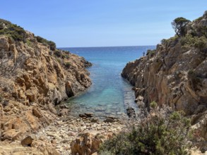 Narrow rock formation opens up to the turquoise-coloured sea, cagliari, sardinia, italy