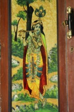 Heritage, glass painting of lord Krishna on door of wooden almira, Mota Devalia, district Amreli,