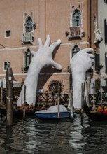 Italy Venice Grand Canal -102 Palazzo Sagredo Giant hands SUPPORT by Lorenzo Quinn installed for