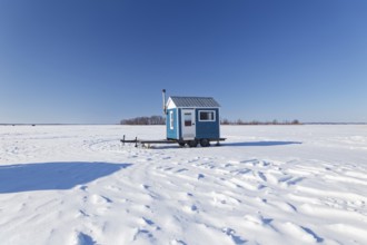 Winter, ice fishing hut on the Saint Lawrence River, Province of Quebec, Canada, North America