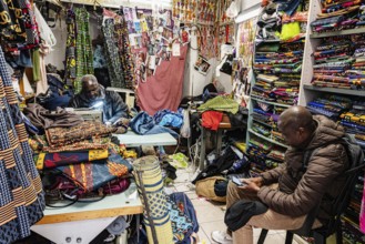 Tailor, black man, African fabrics, Noailles, oriental neighbourhood in Marseille, France, Europe