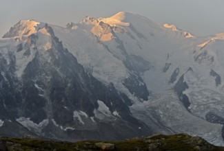 Morning sun on the Mont Blanc massif with Mont Blanc covered in snow and ice, Chamonix, Haute