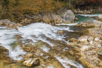 The Riss creek flowing through an autumnal landscape in the Eng valley