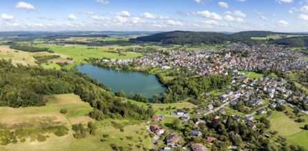 Aerial view of the municipality of Steißlingen with the natural bathing lake Steißlinger See,