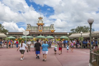 Park visitors walking into the Magic Kingdom at Walt Disney World, Florida, USA, North America