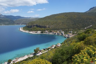 Stunning views of a coastline with beach and hills under a blue sky, Limeni, Areopoli, Laconia,