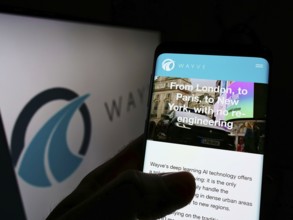 Stuttgart, Germany, 01-23-2022: Person holding cellphone with webpage of British company Wayve