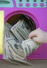 Cleaning black money dollar metaphor, laundry toy wahing machine