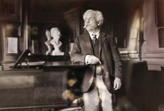Gabriel Fauré, 1845 – 1924, French composer, next to his piano in his appartement, Boulevard
