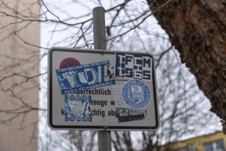 A road sign covered with various stickers and decals, Magdeburg, Saxony-Anhalt, Germany, Europe