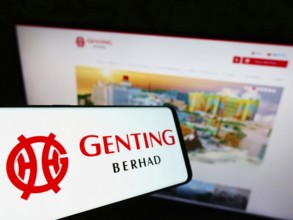 Stuttgart, Germany, 01-15-2022: Mobile phone with logo of Malaysian conglomerate Genting Group on