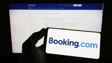 Stuttgart, Germany, 10-24-2022: Person holding smartphone with logo of Dutch online travel agency