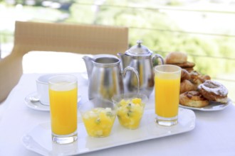 Breakfast with orange juice coffe milk and tea bakery