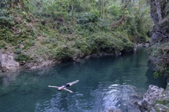 Bather in the river Cuatro Chorros, Lancetillo-La Parroquia, Zona Reina, Quiche, Guatemala, Central