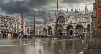 The St. Mark's square in Venice during bad weather and high tide in Venice, Italy, Europe