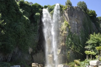 Jardin Extraordinaire, a garden in Nantes, France with a waterfall, rocks and lush vegetation