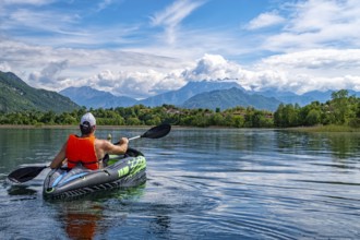 Canoeing scene on Lake Pusiano