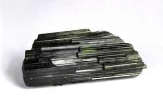 Green tourmaline stone against white background