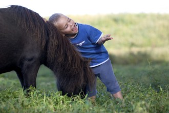 Boy with Falabella pony, Normandy
