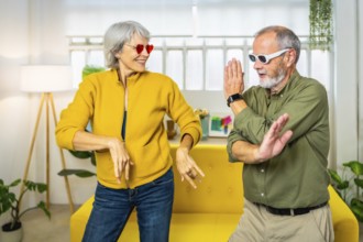 Frontal three quarter length photo of a caucasian married senior couple dancing wearing modern